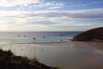 Beach at the Pacific ocean with boats