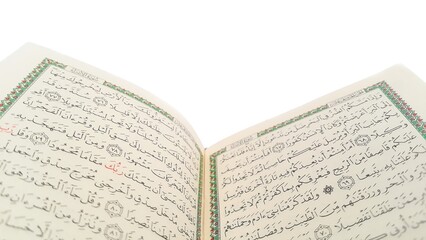 Open Quran pages with white background. Surah Al Baqarah. Arabic letters. Selective focus on letters. Al-Quran is a holy book of Islamic guidance isolated. Religion concept.