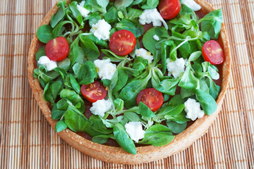Cake of vegetables lying on the wooden background. Healthy cooking concept