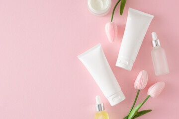 Organic skincare concept. Flat lay photo of cosmetic tubes without label, dropper bottles and...