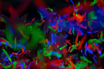 Fototapeta na wymiar Multicolored blurred confetti stripes. Festive background.