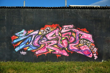 Colorful background of graffiti painting artwork with bright aerosol strips and beautiful colors....