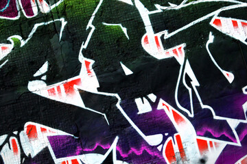 Colorful background of graffiti painting artwork with bright aerosol strips on metal wall. Old...
