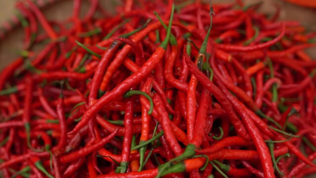 Selective Focus of Red Chillies in a basket at the market.