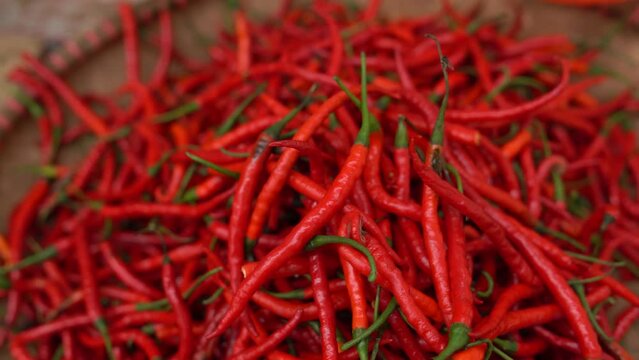 Selective Focus of Red Chillies in a basket at the market.