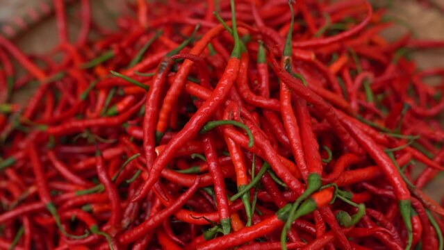 Selective Focus of Red Chillies in a basket at the market.