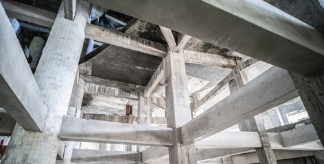 Photo of a house foundation construction with concrete poured. Building inside. Architecture.
