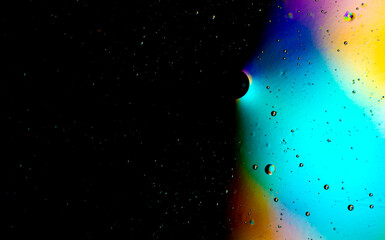 Vegetable oil in water. Abstract circles on the water surface.