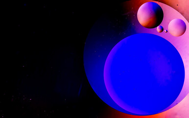 Vegetable oil in water. Abstract circles on the water surface.
