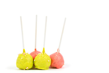 Candies on sticks. Multicolored cakes on a white background. Cake pops