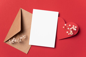 Blank paper Valentines Day card mockup with heart and envelope