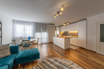 New modern living room with kitchen. New home. Interior photography. Wooden floor