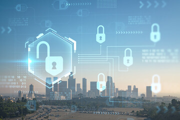 Skyline panorama of Los Angeles downtown at sunset, California, USA. Skyscrapers of LA city. Glowing Padlock hologram. The concept of cyber security to protect companies confidential information