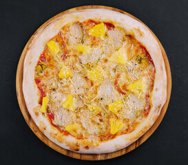 Tasty hawaiian pizza with chicken and pineapple