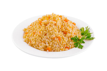 Boiled barley with carrots on plate
