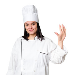 Young caucasian cook woman isolated smiling cheerful showing number five with fingers.