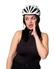 Young caucasian woman wearing a helemet isolated is saying a secret hot braking news and looking aside