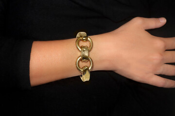 A lady's arm wearing a bracelet