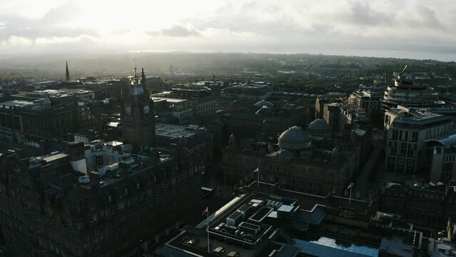 Establishing drone shot of Edinburgh, Scotland at sunset.