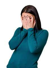 Young caucasian woman isolated blink at the camera through fingers, embarrassed covering face.