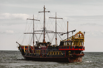 An old wooden sail ship at the sea.
