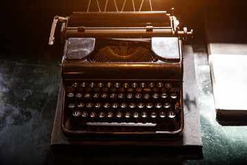 Old vintage typewriter on the desktop.
