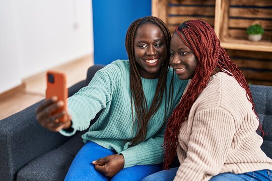 African american women friends smiling confident make selfie by smartphone at home