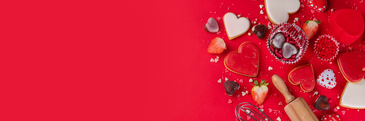 High-colored bright red Valentine day baking background, Various bakery ingredients, cookies,...