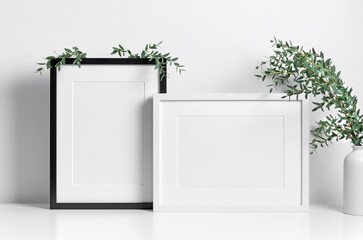 Picture frames mockup in white room with natural eucalyptus twigs, blank frame mockup with copy space - obrazy, fototapety, plakaty
