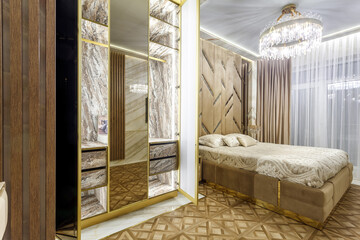 Luxury bedroom interior with parquet and mirror walls