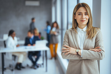 Portrait of a businesswoman standing in a a modern office. Portrait of beautyful and confident...