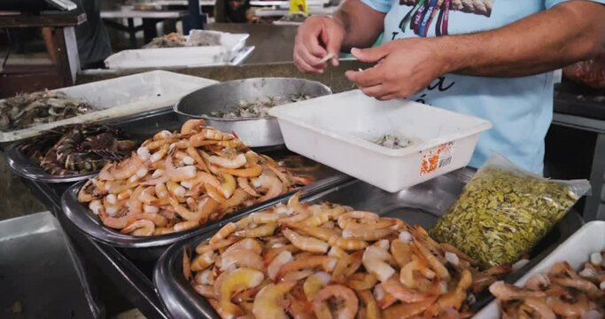 peeling fresh shrimp at the fair