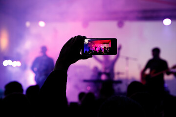 Fototapeta na wymiar Rock band performance, streaming to social networks.