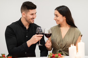 Happily married couple celebrating anniversary at home