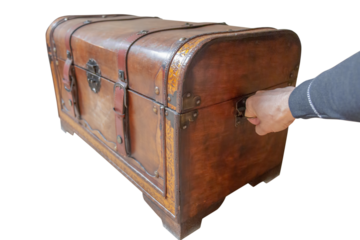 hand pulls an old dowry chest, cut out