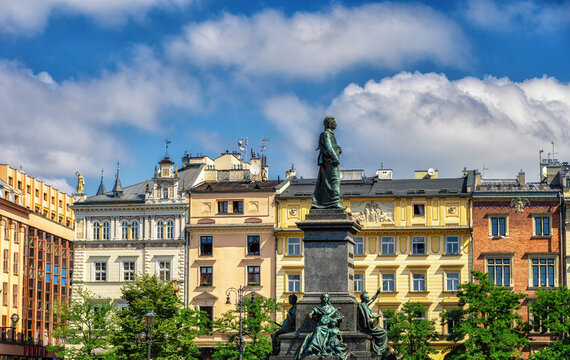 view of the main square in Krakow with the statue of Adamowi Narod