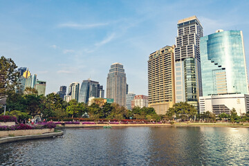 Benchakitti park view with lake and skyscrapers in Bangkok city, Thailand