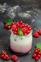 berries Yogurt. Healthy layered dessert with yogurt, jam, red currant and raspberries. Natural detox. banner, menu, recipe place for text, top view