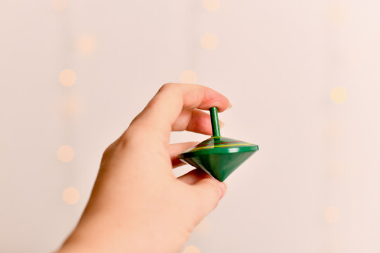 Wooden spinning top Green, colorfully painted
