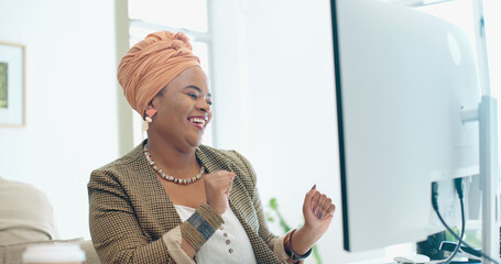 Black woman, computer and fist celebration in office for success, promotion or winning at desk....