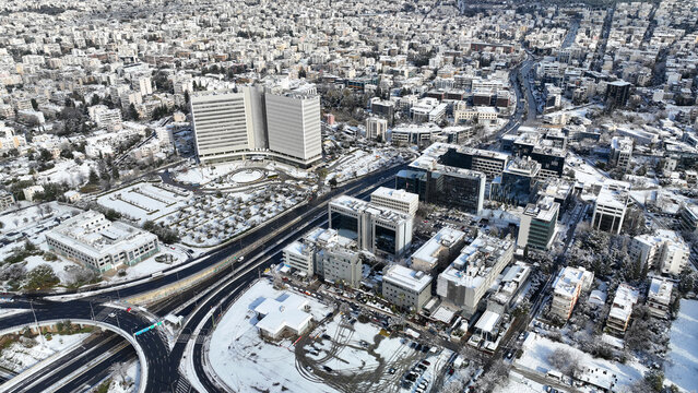 Aerial drone photo of Kifisias avenue and urban area of Marousi covered in snow, Athens, Attica, Greece