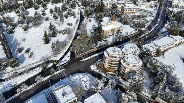 Aerial drone photo of famous public Villa Kazouli a neoclassical masterpiece in the heart of Kifisia covered in snow at winter, North Athens, Attica, Greece