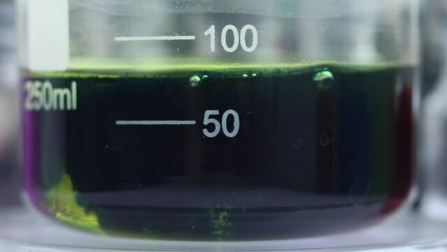 The chemical process of obtaining an inorganic dark blue pigment in the form of a mixture of hexacyanoferrates. In a beaker.