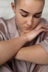 Fototapeta premium Portrait of unhappy pensive woman with cancer.