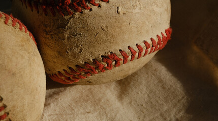 Old used baseball balls closeup with detail of dirty vintage and worn texture for sport game.