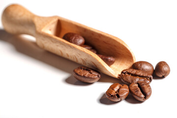 Heap of fresh roasted coffee beans isolated on white background as package design elements