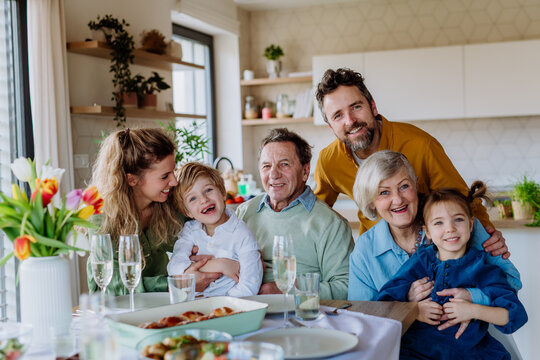 Portrait of happy multigenerational family during Easter dinner.