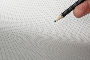 Chart or graph with hand holding pencil and room for text