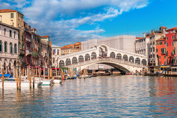 traffic on the Grand Canal near the Rialto Bridge in the background, in Venice, Veneto, Italy