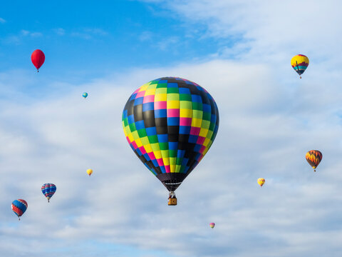 Fototapeta Balloons against clouds and sky, Mass Ascension, Albuquerque International Balloon Fiesta, New Mexico